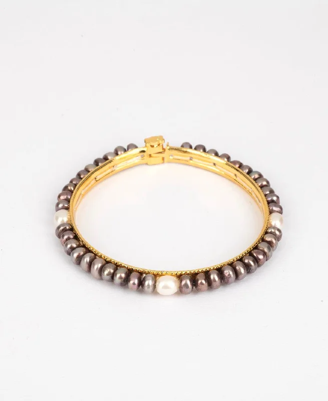 Boho-style bangles for a free-spirited look-Trendy Black and White Pearl Bangle