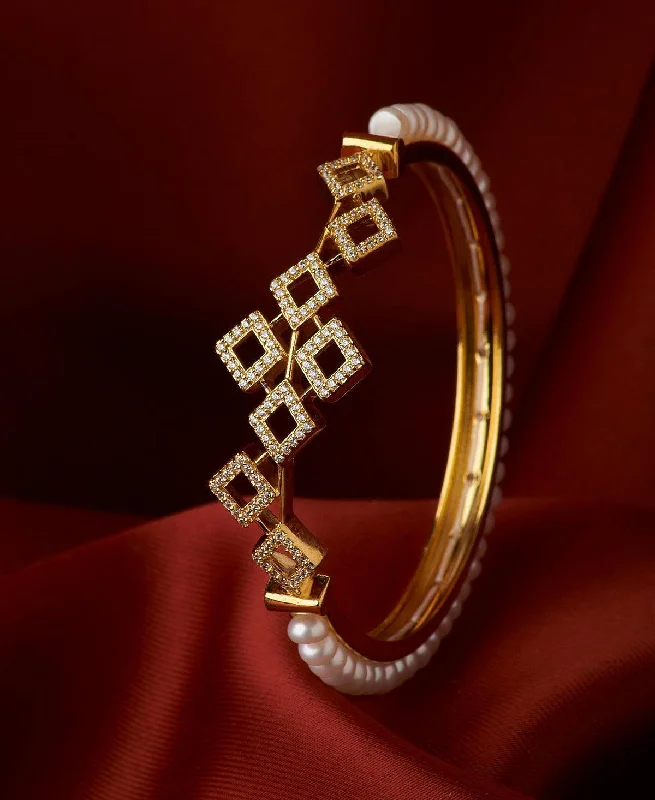 Bangles with floral designs for nature-inspired beauty-Regal Stone Studded Pearl Bangle