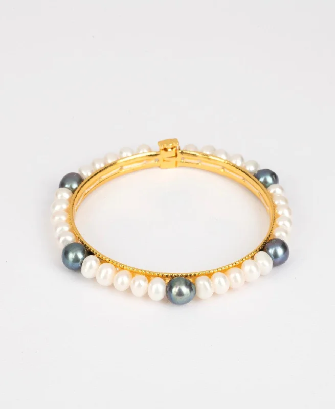 Designer bangles for a fashion-forward statement-Elegant and classy Pearl Bangle