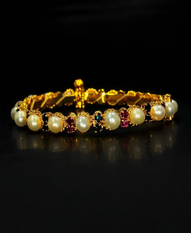 Retro-inspired bangles for a vintage style-Stunning Stone Studded Pearl Bangle