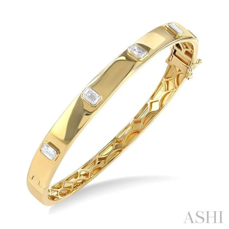 Ethnic-inspired bangles for traditional attire-1 1/2 ctw Bezel Set Emerald Cut Diamond Bangle in 14K Yellow Gold