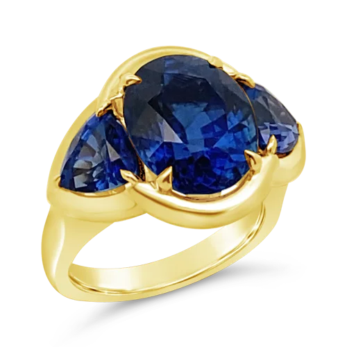 Trendy rose gold rings for modern elegance-Three Stone Blue Sapphire Ring