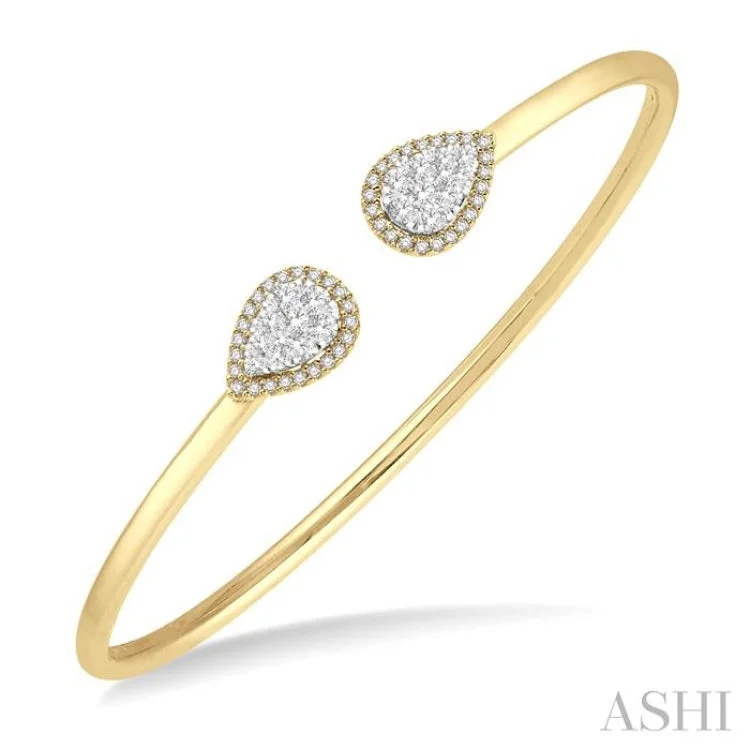 Designer bangles for a fashion-forward statement-5/8 Ctw Round Cut Lovebright Diamond Pear Shape Open Cuff Bangle in 14K Yellow and White Gold