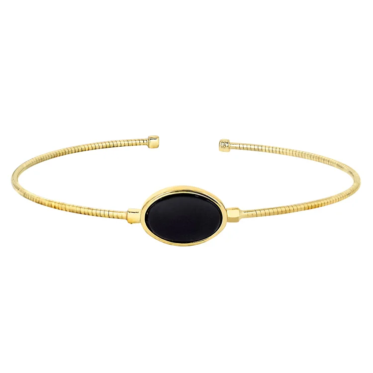 Adjustable friendship bracelets for versatile gifting-Gold Finish Sterling Silver Rounded Omega Cable Cuff Bracelet with an Oval Black Murano Stone