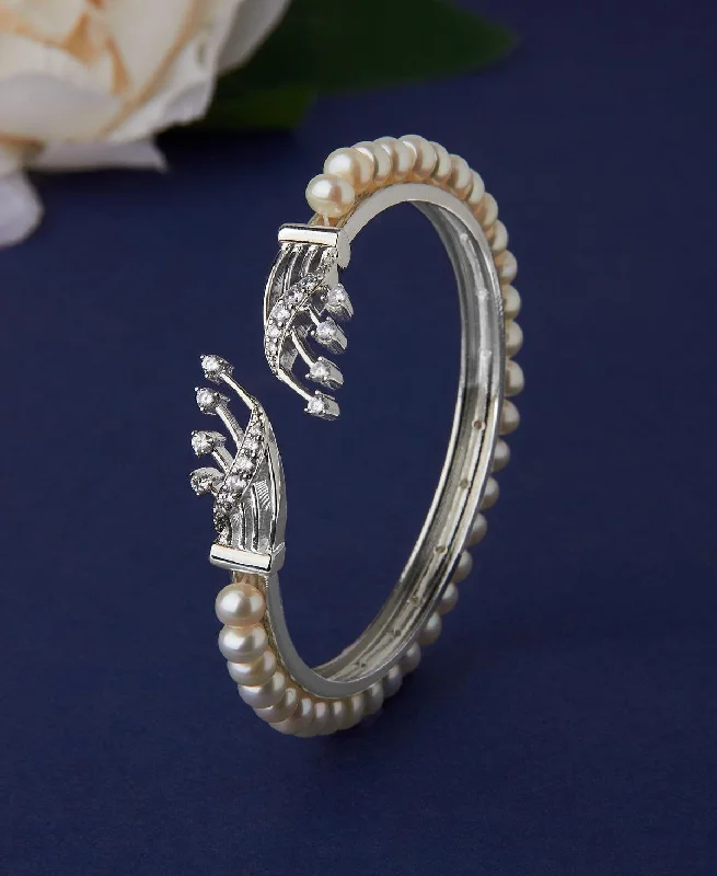 Designer bangles for high-end jewelry collections-Trendy Stone Studded Pearl Bangle