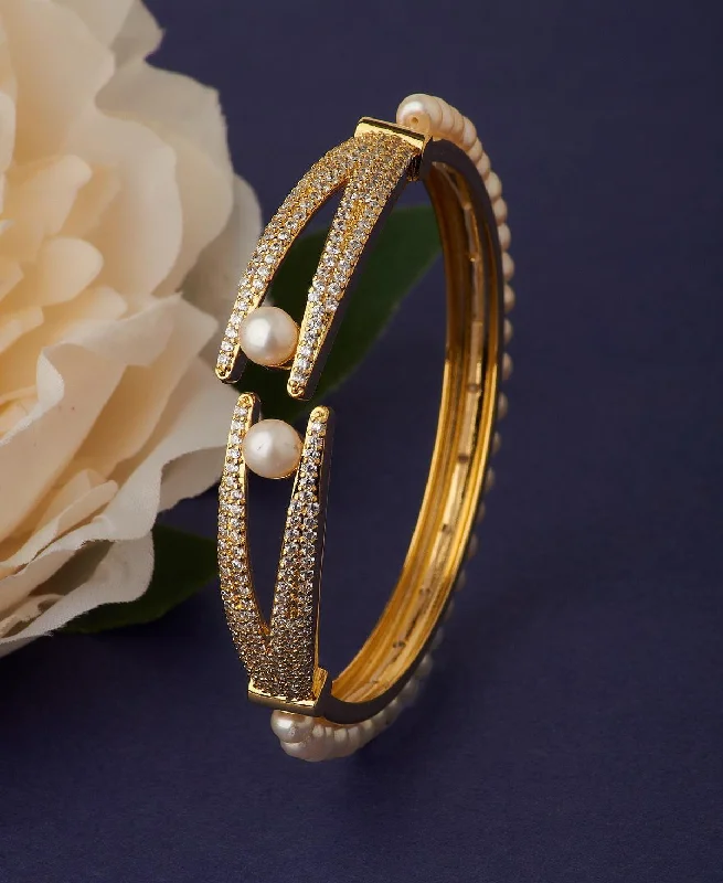 Handcrafted bangles for unique fashion accessories-Stunning Stone Studded Pearl Bangle