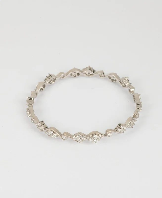 Chic metal bangles for sophisticated fashion-Floral Stone Studded Silver Bangle