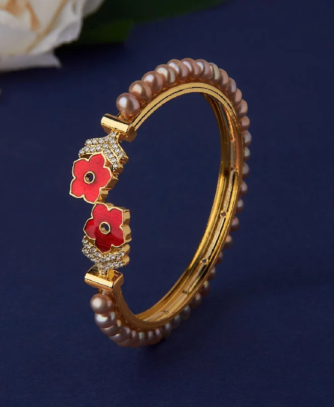 Intricately designed bangles for high-fashion looks-Floral Stone Studded Pearl Bangle